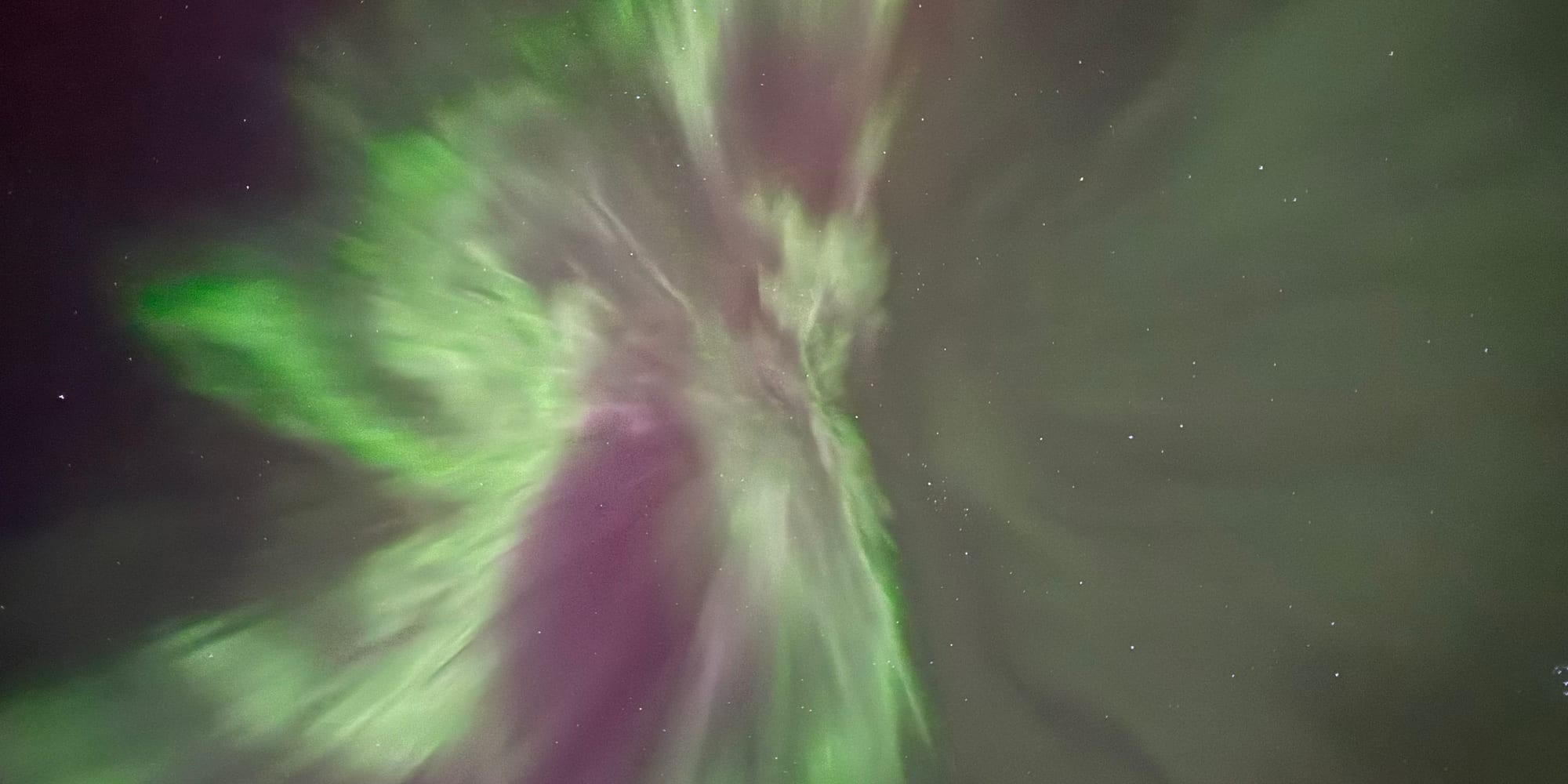 Northern Lights over the mountains outside Tromsø